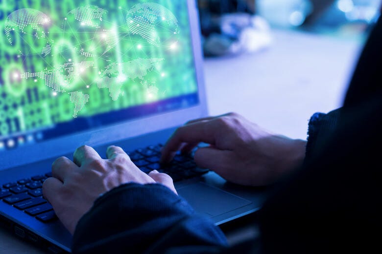 a person typing on a keyboard
